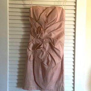 Pinkish dress with a few flowers on it